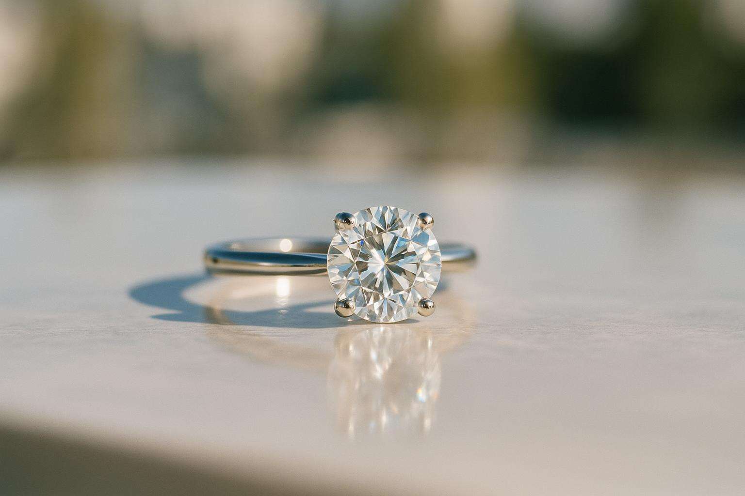 A faceted gemstone still life in soft aquamarine and champagne-gold editorial tones